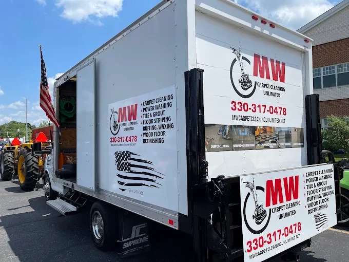 MW Carpet Cleaning Unlimited - Cleaning services and truck with signage